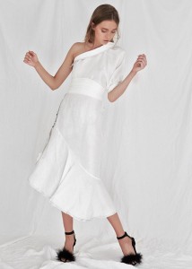 model with long white one shoulder dress