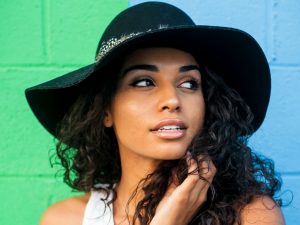 Social Media Drives the Definition of Beauty woman wearing black sunhat