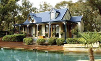 Granny flat with shrubs and a pool