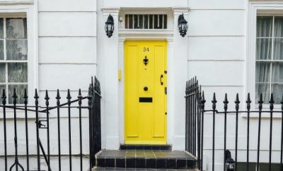 White house with yellow entrance door