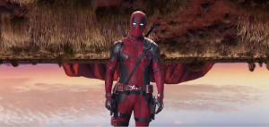 Deadpool with Ayers Rock upside down behind him