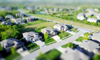 Ariel view of a suburb looking at new houses and green lawns