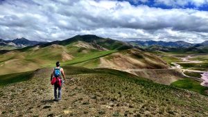 Man alone in a mountain range