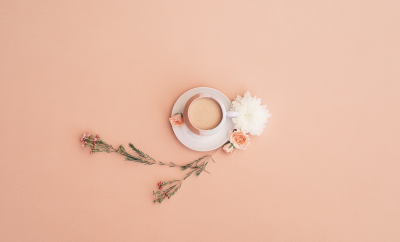 coffee cup in a peach background