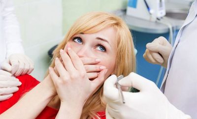 frightened lady at a dentist