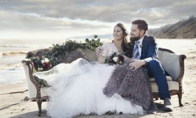 Groom and bride sitting on a bank chair
