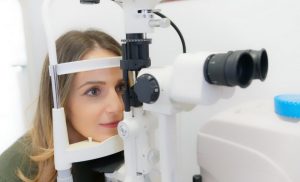 lady having eye checked at optometrist