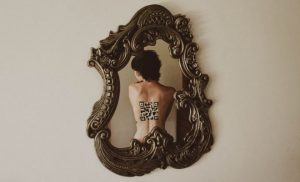 woman's back reflected in a mirror
