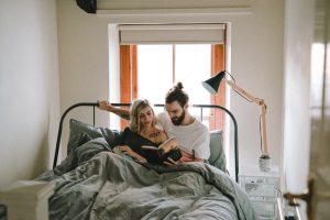 reading couple in bed