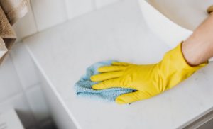 Woman wearing yellow gloves