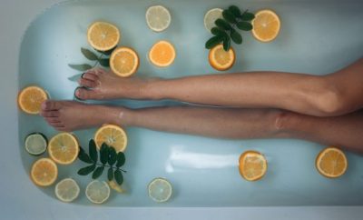selfcare, woman's legs in bathtub