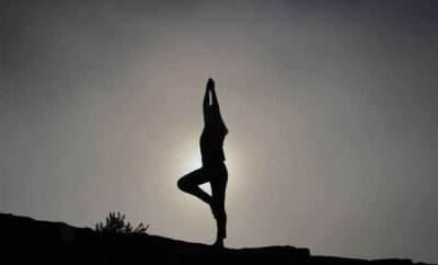 Person doing yoga in the dusk