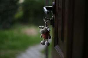 Keys in a door lock with a teddy key