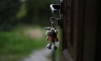 Keys in a door lock with a teddy key