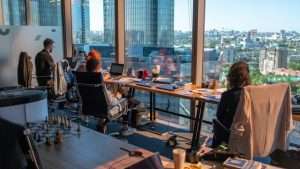 Office and office workers overlooking city views