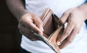 Man opening an empty wallet