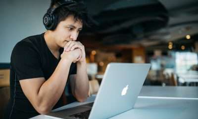 Student with headphones online learning