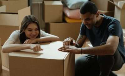 Couple among moving boxes