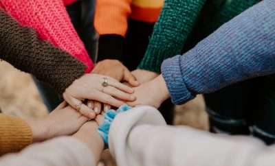 Group of people with hands in
