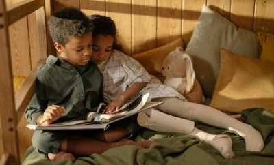 Two kids reading together