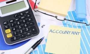 Calculator and a note with word accountant