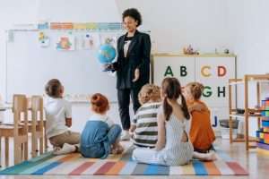 Teacher instructing children