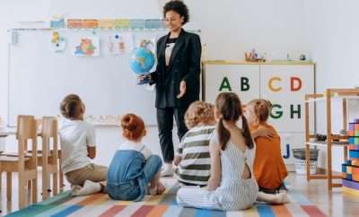 Teacher instructing children