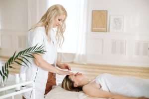 Woman massaging another lady