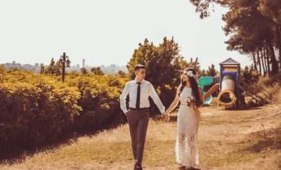 Married couple holding hands walking in nature