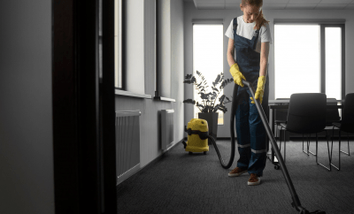 Lady vacuuming carpet