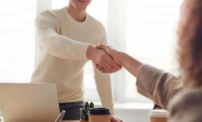 Businessman shaking hands with another