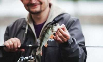 men holding a fish