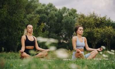 Women doing yoga in the park