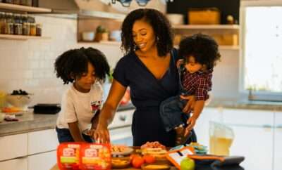 mother preparing food with kids