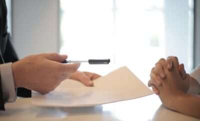 Picture of hands holding paper and pen