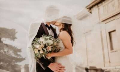 Groom and bride kissing on wedding day