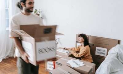 Couple packing to move house