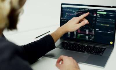 Man looking at his laptop for financial performance