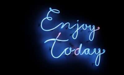 Neon words 'Enjoy Today"