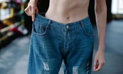 Close-up of Woman Wearing Loose Pants after Diet