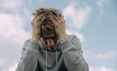 Frustrated desperate young man coping with loss, grief, emotional trauma, depression