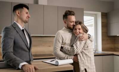 Couple happily embracing in kitchen